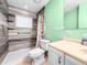 Well-maintained bathroom featuring a shower-tub combo with decorative tile and a white vanity at 487 49Th N Ave, St Petersburg, FL 33703