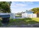 Property with white fence, showcasing well-maintained grounds with palm trees, and providing both privacy and curb appeal at 487 49Th N Ave, St Petersburg, FL 33703