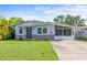 Charming single-story home with a well-maintained lawn and welcoming curb appeal at 487 49Th N Ave, St Petersburg, FL 33703