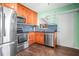 Bright kitchen features stainless steel appliances, including a refrigerator, microwave, oven, and dishwasher at 487 49Th N Ave, St Petersburg, FL 33703