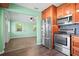 Kitchen view featuring stainless steel appliances and views into an adjoining living area at 487 49Th N Ave, St Petersburg, FL 33703
