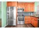 Bright kitchen with stainless steel appliances, including a fridge, oven, and microwave at 487 49Th N Ave, St Petersburg, FL 33703