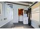Cozy sunroom with carpet flooring, laundry area and exterior access, creating a functional and inviting space at 487 49Th N Ave, St Petersburg, FL 33703