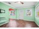 Living room with tile flooring, large windows, and a front door entry at 487 49Th N Ave, St Petersburg, FL 33703