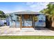 Unique rear exterior with custom murals and modern design elements, complemented by the concrete patio area at 487 49Th N Ave, St Petersburg, FL 33703