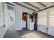 Cozy sunroom with carpet flooring, laundry area and exterior access, creating a functional and inviting space at 487 49Th N Ave, St Petersburg, FL 33703