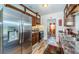 Functional kitchen with stainless steel appliances, wooden cabinets, and a view into the adjacent living space at 509 N Washington Ave, Clearwater, FL 33755