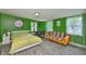 A cozy bedroom with a neutral-toned walls, light streaming through windows, and wood-look flooring at 5840 39Th N St, St Petersburg, FL 33714
