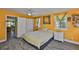 Bedroom featuring colorful walls, natural light, and a view into the connected living spaces at 5840 39Th N St, St Petersburg, FL 33714