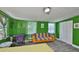 Bright bedroom features hardwood floors, natural light, and a vibrant color scheme at 5840 39Th N St, St Petersburg, FL 33714