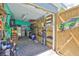 Well-equipped garage with ample storage, shelving, refrigerator, and workspace at 5840 39Th N St, St Petersburg, FL 33714