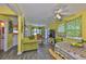 The living room has wood-look floors and a view of the kitchen, as well as the backyard at 5840 39Th N St, St Petersburg, FL 33714