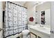 Bathroom featuring a shower with a nautical themed shower curtain, toilet, and vanity with a sink at 603 Bainbridge Dr, Brandon, FL 33511
