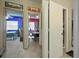 Hallway view showing access to bedrooms with bright wall colors and a bathroom in a single-story home at 603 Bainbridge Dr, Brandon, FL 33511