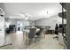 Bright living area boasting tile flooring, a ceiling fan, and seamless access to outdoor spaces at 603 Bainbridge Dr, Brandon, FL 33511