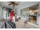 Enclosed porch with a ceiling fan, outdoor furniture, and a sliding glass door to the home's interior at 603 Bainbridge Dr, Brandon, FL 33511