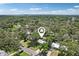 Overhead view of the property surrounded by mature trees in a quiet, residential neighborhood at 607 E River Dr, Temple Terrace, FL 33617