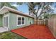 The backyard is spacious and features lush landscaping at 607 E River Dr, Temple Terrace, FL 33617