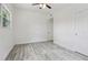 Bright bedroom features a ceiling fan, and wood-look floors at 607 E River Dr, Temple Terrace, FL 33617