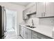 Stylish kitchen featuring stone countertops, sleek cabinetry, and stainless steel appliances at 607 E River Dr, Temple Terrace, FL 33617