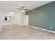 Bright living room featuring an open layout, neutral paint, stylish floors, and a ceiling fan at 607 E River Dr, Temple Terrace, FL 33617