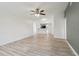 Spacious living room featuring neutral paint, stylish floors, an open layout, and a ceiling fan at 607 E River Dr, Temple Terrace, FL 33617