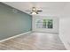 Spacious living room featuring stylish floors, fresh paint, and a bright window view at 607 E River Dr, Temple Terrace, FL 33617