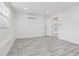 Bright and open room featuring recessed lighting, an air conditioning unit, and light wood flooring at 607 E River Dr, Temple Terrace, FL 33617