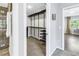 Walk-in closet with custom shelving and rods, providing organized storage space adjacent to ensuite at 610 Cordova Ne Blvd, St Petersburg, FL 33704