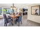 Dining room with decorative table setting and view to kitchen and outside at 610 Cordova Ne Blvd, St Petersburg, FL 33704