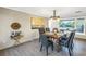 Dining room with elegant chandelier and a dining table, and views of the entry area at 610 Cordova Ne Blvd, St Petersburg, FL 33704