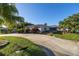 Charming single-story home with lush landscaping and circular driveway, offering curb appeal at 610 Cordova Ne Blvd, St Petersburg, FL 33704