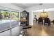 Kitchen with sleek black refrigerator and breakfast nook area with backyard and pool views at 610 Cordova Ne Blvd, St Petersburg, FL 33704