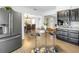 Open kitchen with bar seating connected to the dining room with a view of the stainless steel refrigerator at 610 Cordova Ne Blvd, St Petersburg, FL 33704