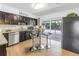 Updated kitchen with stainless steel appliances, a breakfast bar and a view to the outside pool area at 610 Cordova Ne Blvd, St Petersburg, FL 33704