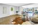 Bright living space with hardwood floors, a comfortable seating area, and a view into other rooms at 610 Cordova Ne Blvd, St Petersburg, FL 33704