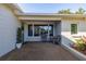 Inviting covered patio area with comfortable seating, perfect for outdoor relaxation at 610 Cordova Ne Blvd, St Petersburg, FL 33704