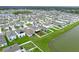 Scenic aerial of a community home showing proximity to a lake and surrounding neighborhood at 636 Olive Conch St, Ruskin, FL 33570