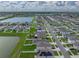 An aerial view of the community shows a neighborhood with lake, ponds and lush landscaping at 636 Olive Conch St, Ruskin, FL 33570