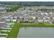Aerial shot of the home's backyard and proximity to the lake within a community neighborhood at 636 Olive Conch St, Ruskin, FL 33570