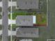 Aerial view of the property showing the roof, backyard landscaping, and surrounding neighborhood at 636 Olive Conch St, Ruskin, FL 33570
