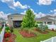 Spacious backyard with lush landscaping and a screened-in patio perfect for outdoor enjoyment at 636 Olive Conch St, Ruskin, FL 33570