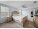 Lovely main bedroom featuring hardwood floors, ceiling fan, large windows and a closet at 636 Olive Conch St, Ruskin, FL 33570