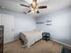 Bedroom featuring neutral carpet, shelving and a dark side table at 636 Olive Conch St, Ruskin, FL 33570