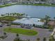 The community clubhouse offers a pool, playground, parking, and a well-maintained lawn area at 636 Olive Conch St, Ruskin, FL 33570
