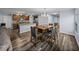 Open-concept area with a chandelier, seamlessly connects the kitchen and dining spaces at 636 Olive Conch St, Ruskin, FL 33570