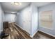 The entryway features wood-look flooring and white trim, adding a touch of elegance at 636 Olive Conch St, Ruskin, FL 33570