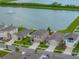Exterior showcasing a well-maintained home within a beautiful, planned community and near a lake at 636 Olive Conch St, Ruskin, FL 33570