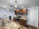 Well-equipped kitchen boasts granite counters, stainless appliances and ample cabinet space at 636 Olive Conch St, Ruskin, FL 33570