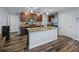 Well-equipped kitchen with granite counters, stainless steel appliances, ample cabinet space and a center island at 636 Olive Conch St, Ruskin, FL 33570
